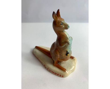 A Carltonware Guinness ceramic advertising figure of a kangaroo with a bottle in it's pouch, applied red marks to the base, w