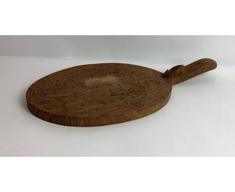 A Robert 'Mouseman' Thompson chopping board, the board of oval form with a slightly raised handle and mouse to this, approxim