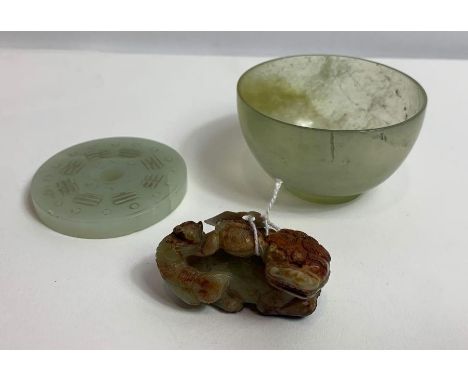 A Chinese jade bowl, 7cm diameter; along with a jade disc depicting the eight Trigrams and C-scrolls; and a model of a Buddhi