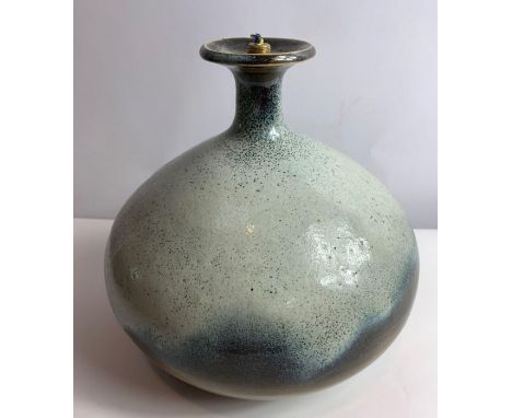 Waistel Cooper (1921-2003); a sage green and light brown glazed lamp base, of round bulbous form, with flared lip and on foot