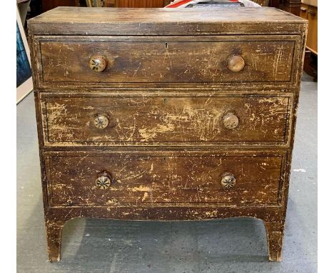 A Regency painted pine chest of drawers, having the original border detailing throughout, three long drawers and raised on br