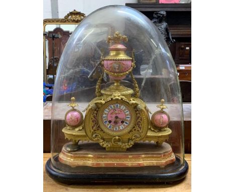 A late 19th century French ormolu and painted porcelain mantel clock upon a shaped giltwood stand with original glass dome; 2