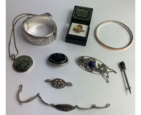 A citrine set silver ring; a silver hinged bangle; a bangle stamped ‘9ct &amp; Sil’; and other items of jewellery