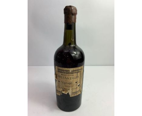 A bottle of vintage Constantino's 1945 port with applied paper label