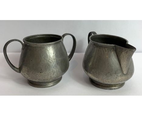 A Liberty &amp; Co "Tudric" hammered pewter sucrier and milk jug, stamped marks to the base