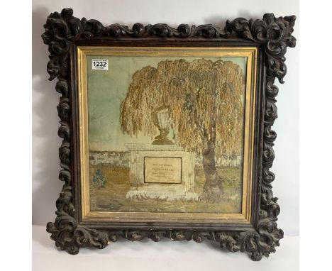 An unusual 19th century tapestry picture of a weeping willow above a stone monument, written on the monument "Sacred to the m