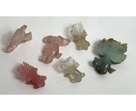 A collection of hardstone carvings of fish, in various colours, possibly jade 