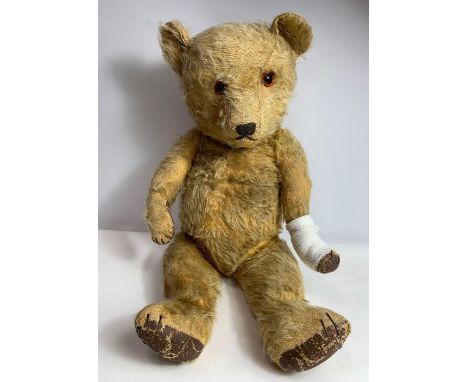 A 20th century vintage golden teddy bear, 55cm long  