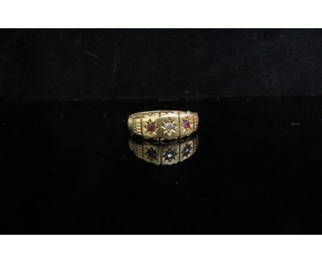 An 18ct gold diamond and ruby ring. Size M, 2.8g