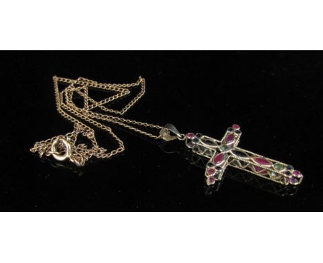 A 9ct gold ruby and sapphire set cross pendant hung on a gold chain, stamped 9c, 3g