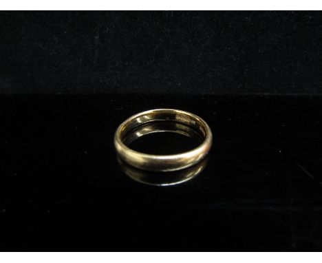 A 22ct gold wedding band, slightly miss-shaped. Size R, 5.3g