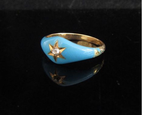 A gold ring with enamel turquoise front centrally set with a diamond in star setting, unmarked, slight damage to enamel on sh