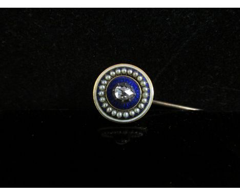 A stick pin with blue enamelled seed pearl finial set with an old pear cut diamond 0.25ct approx