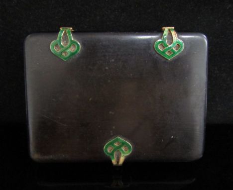 An ebonised card case with green enamelled Art Nouveau clasp and hinges, some wear to enamel, the clasp set with a single dia