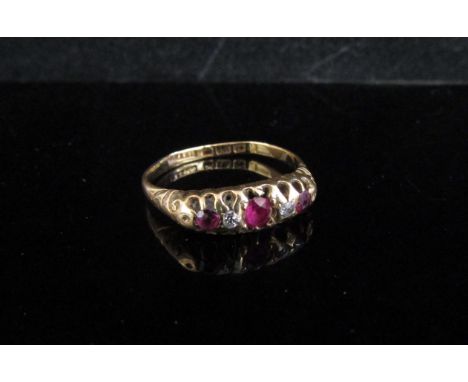 An 18ct gold ruby and diamond ring, worn shank. Size M, 2.7g