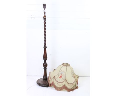 Early 20th century Oak Standard Lamp with a Pig Skin Shade decorated with figures and with a frilled edge 