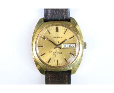 Garrard Automatic 25 jewel gold plated wrist watch with leather strap presented by British Leyland cars for long service to P