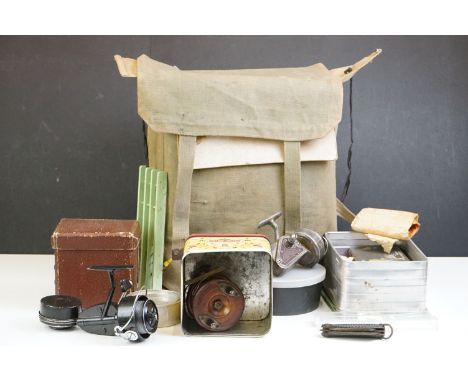 WW2 military haversack (dated 1943), containing an Air Ministry box and a quantity of fishing collectables to include reels (
