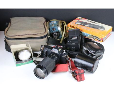 A collection of vintage photographic equipment to include a Canon T50 35mm SLR camera with lens together with a Kodak advanti