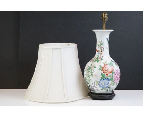 20th Century Chinese Famille Rose baluster vase converted to a table lamp, decorated with flowers, birds and butterflies, on 