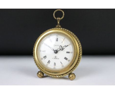 A vintage Swiza 7 Jewel, 8 day travel alarm clock. 