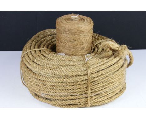 A vintage ball of brown string together with a roll of rope. 