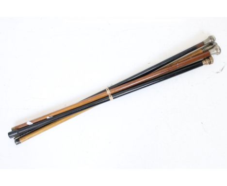 Five early 20th century wooden walking sticks to include three silver mounted examples (featuring Chester 1909 &amp; London 1