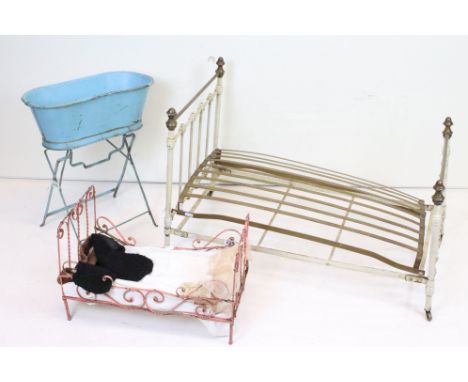 Two vintage metal dolls bed frames together with a dolls bath. 