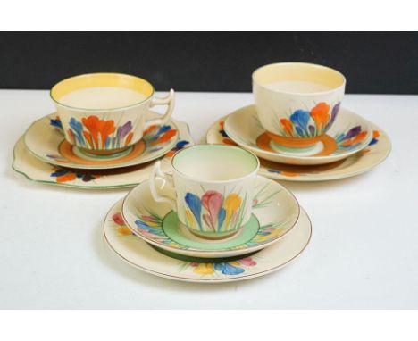 Three Clarice Cliff 'Crocus' pattern trios to include a Wilkinson Pottery 'Bizarre' trio, Royal Staffordshire 'Spring Crocus'