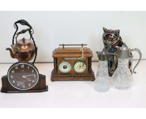 A box of mixed collectables to include a copper kettle and burner, claret jugs, bakelite mantle clock....etc. 