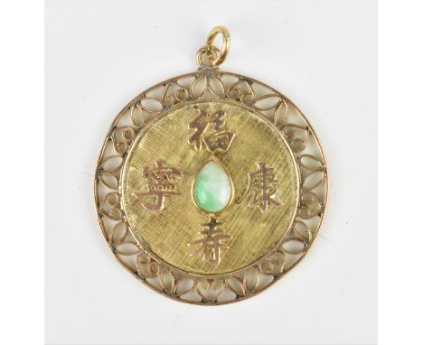 A 14ct yellow gold and green jade pendant, of circular form with pierced scroll border, the centre with pear shaped jade on a