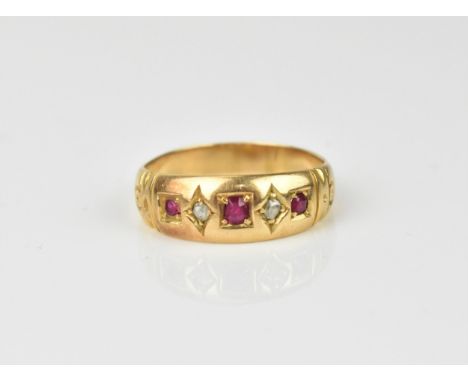 A yellow metal, diamond and ruby gypsy style ring, size O, weight 3.5 grams 