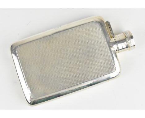 An Elizabeth II silver hip flask by Mappin &amp;Webb, 1954, imported in France, stamped to underside 'Paris' and 'Angleterre'