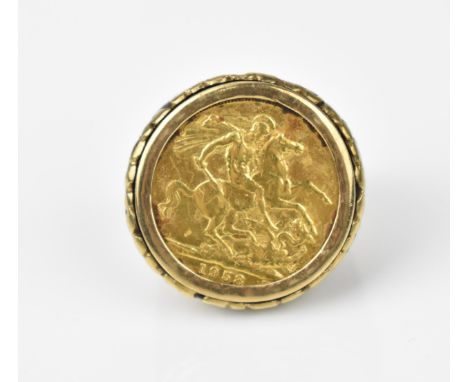 An Elizabeth II full gold sovereign coin mounted in a gentleman's Modernist yellow metal ring setting, size P, total weight 1