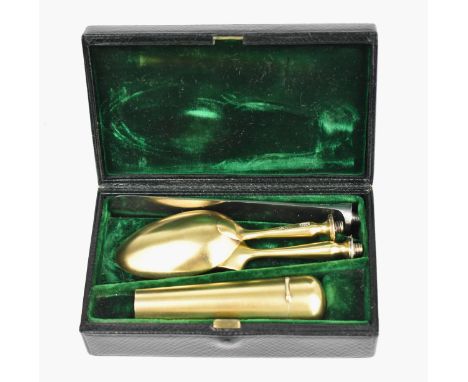 A cased late Victorian silver-gilt traveling cutlery for one by Norman Marshall, London 1900, comprising a knife, fork, spoon