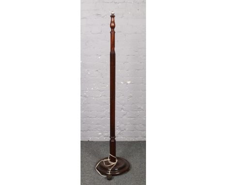A mahogany standard lamp with reeded and turned column.  