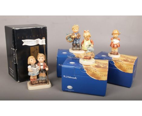 A boxed Hummel Club figure, Celebrate with Song, along with three other boxed Hummel Goebel figures.  Repair to banner of Cel