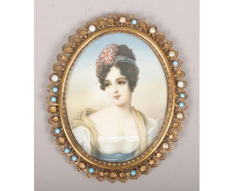 An ornate gilt framed oil miniature portrait of a maiden. (11cm x 9cm)  