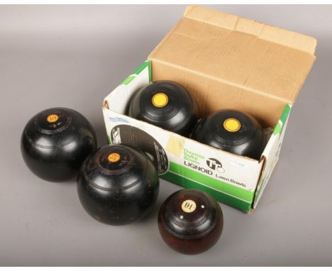 Two sets of Thomas Taylor lawn bowls, No. 2 bias (boxed) and No. 3 bias, along with a vintage turned wooden jack.  