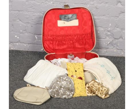 A vintage suitcase to include vintage handbags  