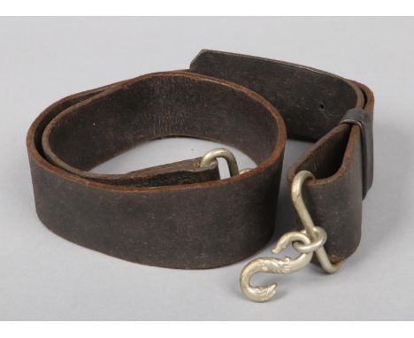 A World War I pattern British Army leather belt with serpent formed buckle.  Some slight cracking to the leather. Overall goo