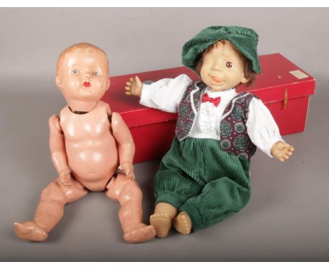 A vintage composite jointed doll, along with a boxed Gloobee doll.  