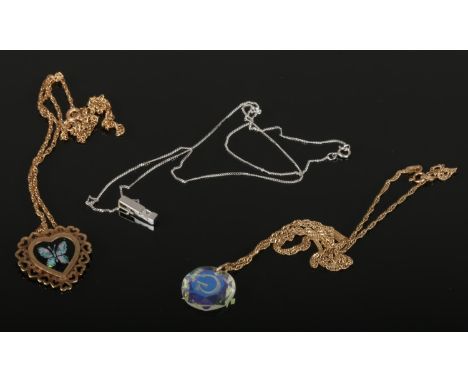 Three vintage 9ct gold pendants and chains including a white gold example and gwendafoil heart shaped pendant.  