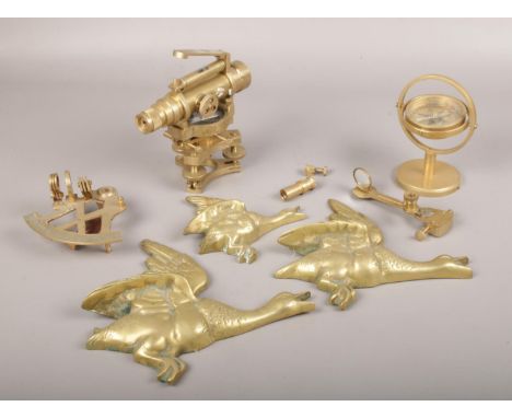 A collection of brassware, to include surveyor's level and scope, compass on stand etc.  