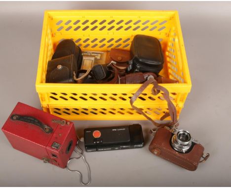 A box of camera equipment to include box camera, Halina camera, binoculars, automatic flash etc.  