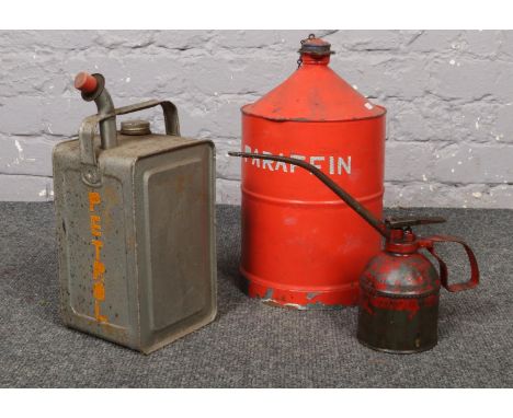 Two vintage oil cans, along with a similar oil spray.  