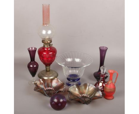 A group lot of glassware to include oil lamp, paperweight, coloured glass bowl etc.  