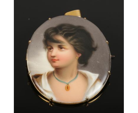 A miniature portrait of a maiden painted on porcelain in yellow metal mount.  