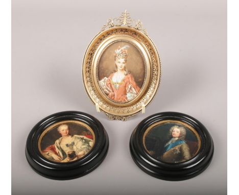 A gilt frame oil on board portrait miniature of a maiden, along with a pair of similar framed prints. (Oil 8.5cm x 6.5cm).  