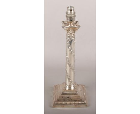 A silver plate ornate table lamp base of Corinthian column form.  